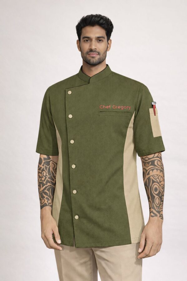 Olive green chef coat with beige side panels, asymmetrical button front, and short sleeves