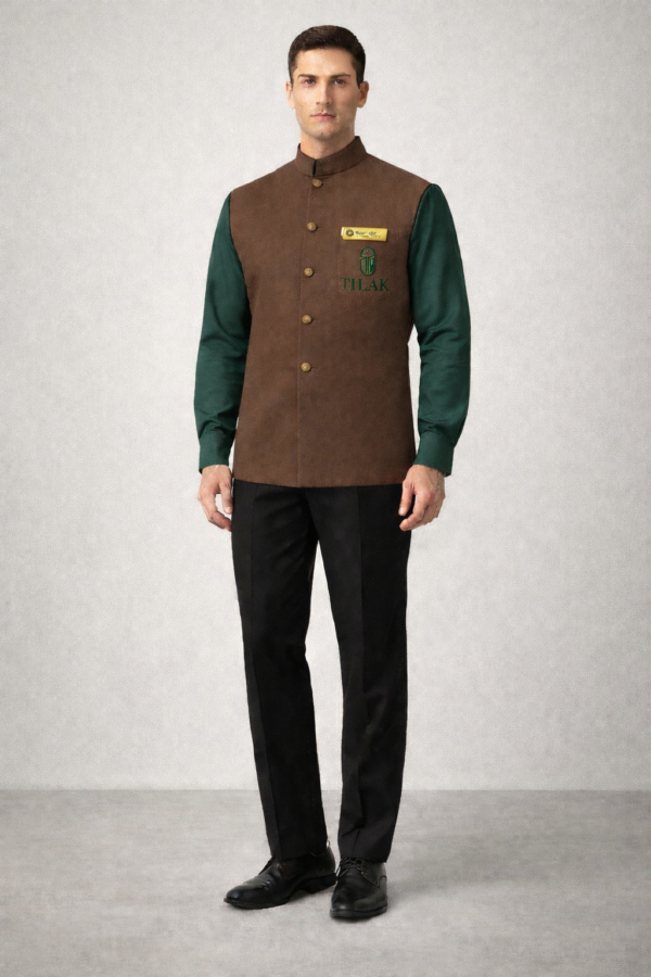 Brown Nehru waistcoat with subtle logo branding, paired with a dark green full-sleeve shirt and black trousers.